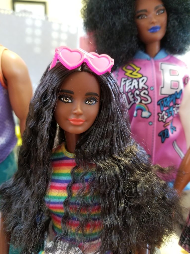 Barbie Fashionista 166 with long wavy hair and rainbow clothes