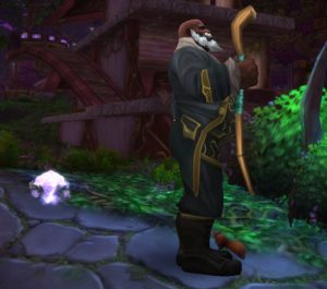 World of Warcraft character in the Darkmoon Nobleman cosmetic set facing the camera