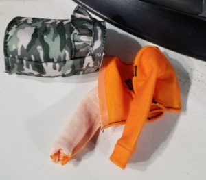 Barbie Fashionista 107's original clothes, discarded